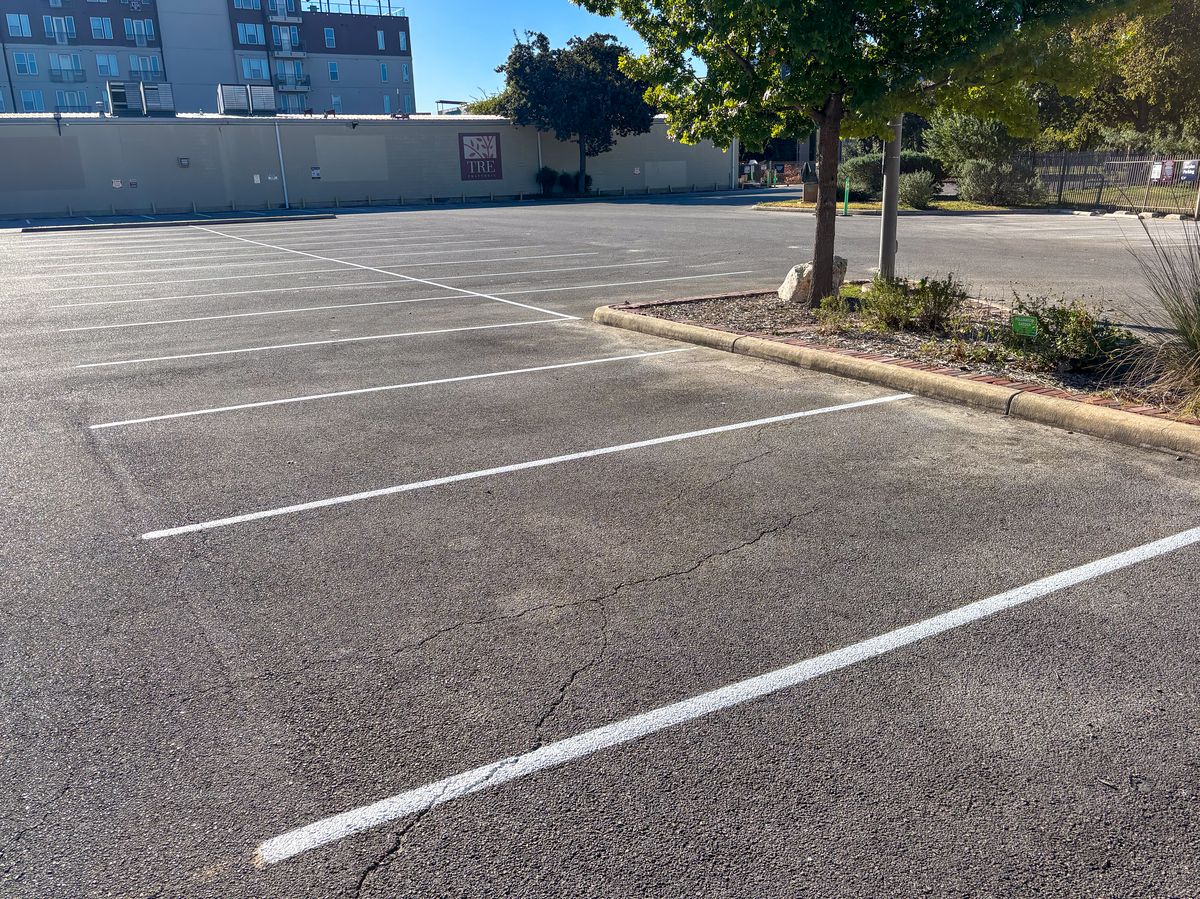 Commercial parking lot with fresh white stall lines