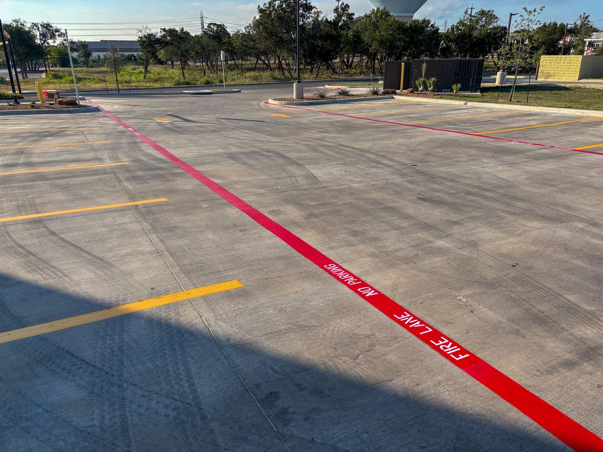 New construction parking lot with fire lane and yellow stall markings