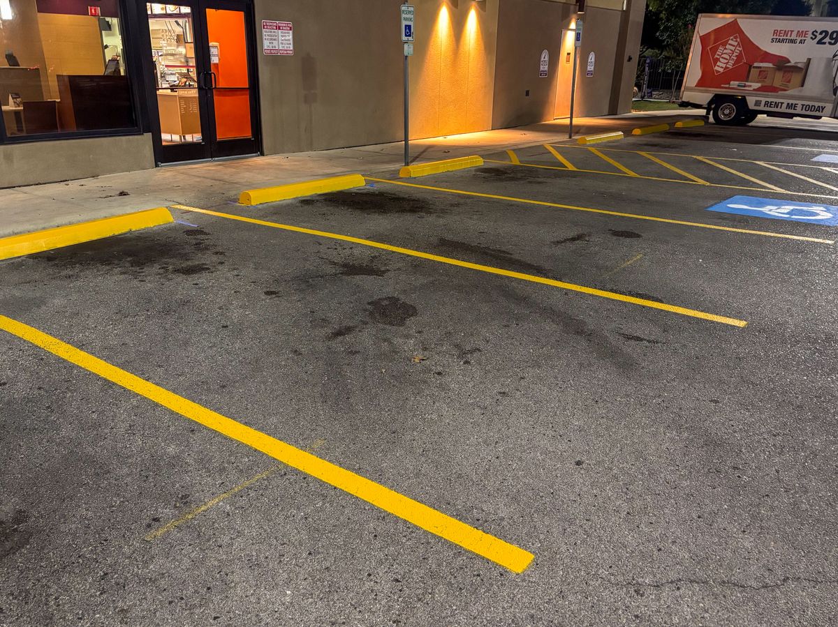 Yellow handicap parking stalls with access aisles